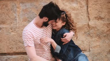 Young couple having holiday romance