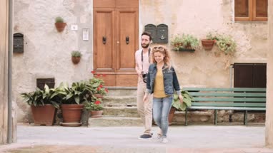 Young tourists using camera on vacation
