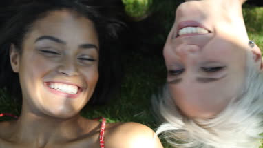 Friends lying on grass