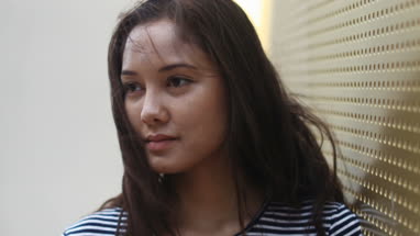 Young female with wind in hair