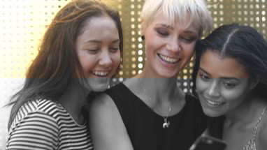 Young female friends taking selfie