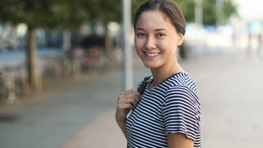 Young female walking down street
