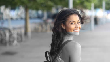 Young female walking down street