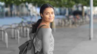 Young female walking down street