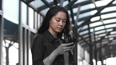 Young asian female waiting of station platform