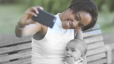 Afro-american mother and baby taking selfie