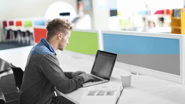 Adult student working in library