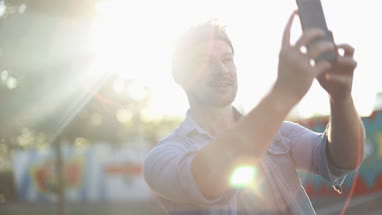 Trendy male taking selfie