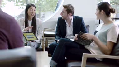 Business meeting in office lobby