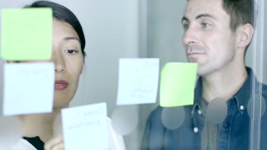 Creative Team brainstorm together with notes