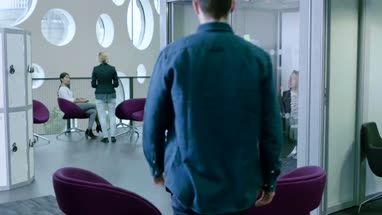 Women Working Together in busy office