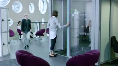 Women Working Together in busy office