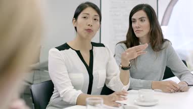 Women Working Together in meeting room