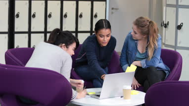 Female students working on a project together