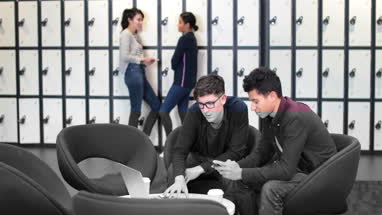 Male students working on a project together