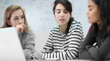 Female students working on a project together