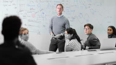 Professor asking student a question in lesson