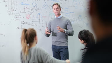 Professor explaining theory to students