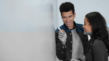 Student writing on whiteboard