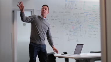 Businessman in meeting room giving presentation