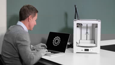 Engineer with 3D printer