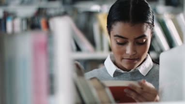 Student reading in a library