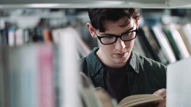 Student reading in a library