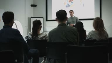 Professor teaching with projector