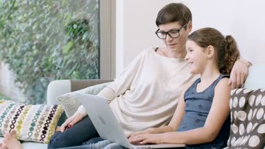Mom using laptop for leisure