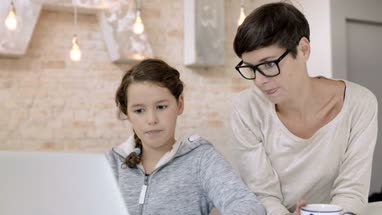 Mom checking daughter is safe on internet
