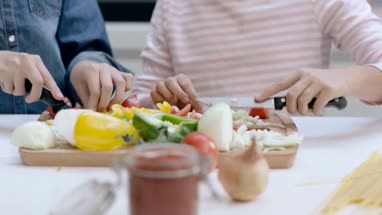 Close-up kids hands preparing a meal
