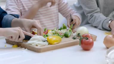 Mom teaching daughter to cook a meal