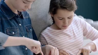 Mom watching kids cook a meal