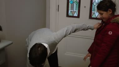 Mom saying goodbye to daughter at the door