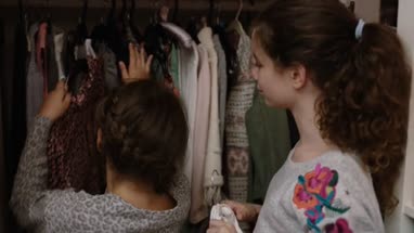 Sisters sharing clothes