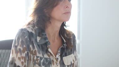 Mature business woman working on desktop computer