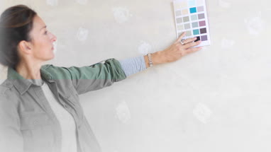 Mature female looking at colour card