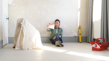 Mature female looking at colour card