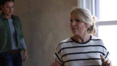 Mature female showing friend around property