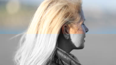 Mature female outdoors looking at view