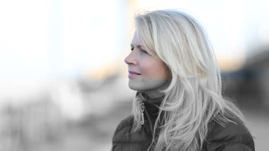 Mature female outdoors looking to camera