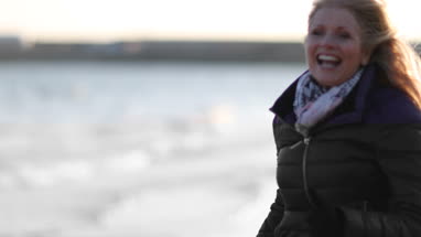 Mature female friends running outdoors