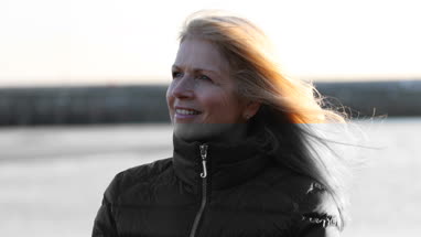 Mature female outdoors looking to camera