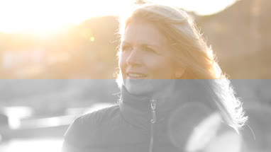 Mature female outdoors looking to camera