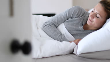 Young adult female waking up in the morning