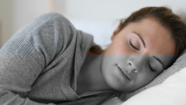 Young adult female waking up in the morning