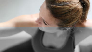 Young adult female doing yoga at home