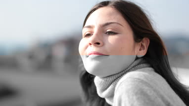 Woman leaning on balcony to enjoy the view