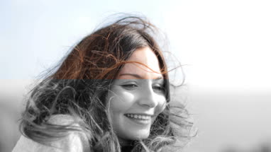 Carefree woman with wind in her hair