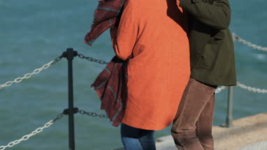 Couple having fun by coastline